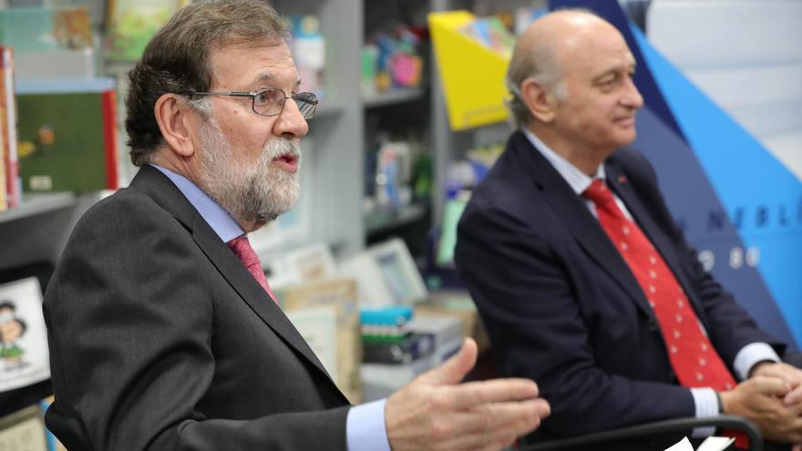 Mariano Rajoy y el exministro del Interior, Jorge Fernández Díaz, durante la presentación del libro del segundo.