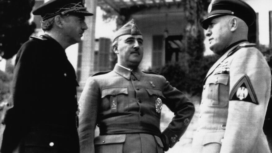 Spain's Foreign Minister Serrano Suner, left, the Spanish Head of State General Francisco Franco and Italy's Premier Benito Mussolini, right, photographed in Italy on March 5, 1941, during their recent meeting. 